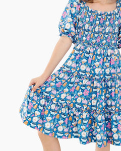 SS FLUTTER FLWRS SMOCK RUFF TIER DRESS